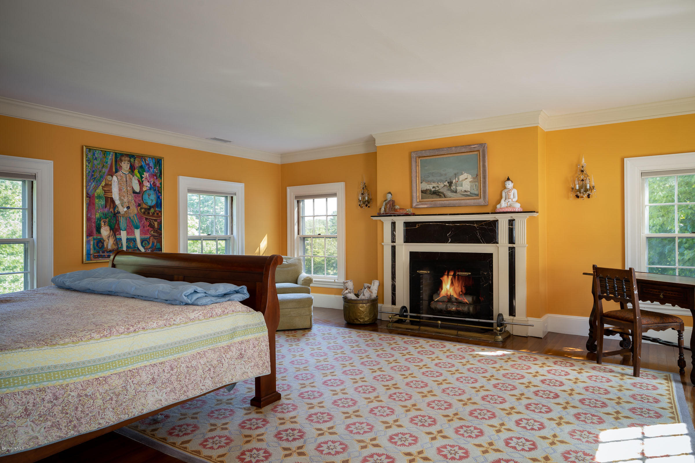 119 Under Mountain Road Lenox, MA 01240 - Photo 17 of 46 a bedroom with a bed and a fireplace