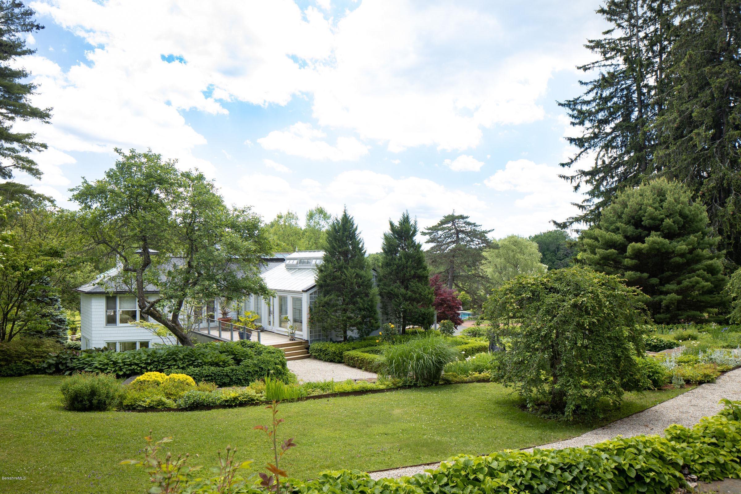 119 Under Mountain Road Lenox, MA 01240 - Photo 41 of 46 a view of a garden with a fountain