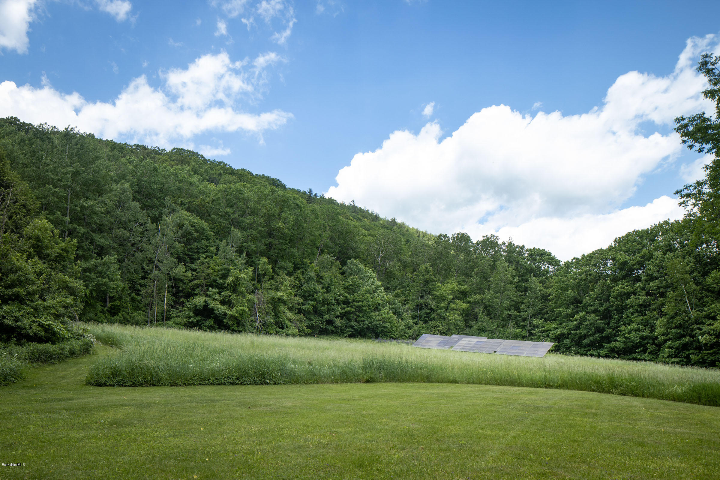 119 Under Mountain Road Lenox, MA 01240 - Photo 45 of 46 a view of a golf course with a lake