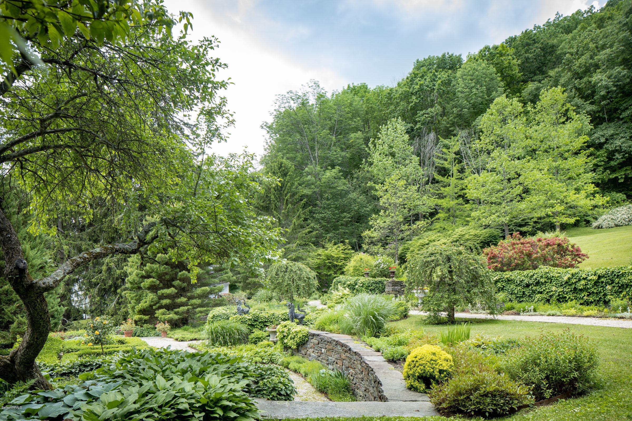 119 Under Mountain Road Lenox, MA 01240 - Photo 6 of 46 a view of a garden with a lake