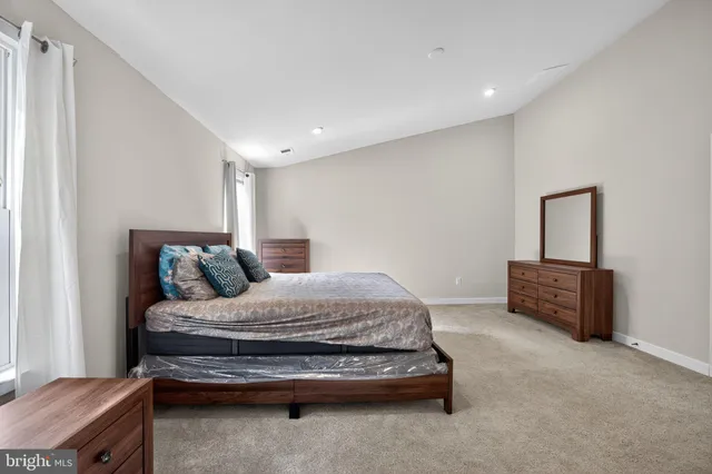 a bedroom with a bed and a cabinets