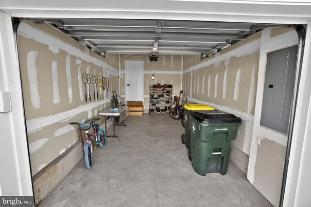 a view of water heater room with stairs
