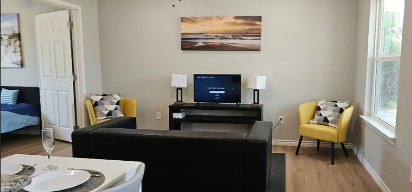 1701 Sycamore Street Temple, TX 76502 - Photo 2 of 20 a living room with furniture and a wooden floor