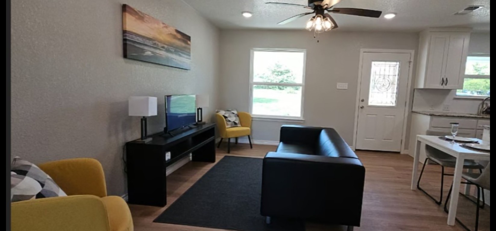 1701 Sycamore Street Temple, TX 76502 - Photo 3 of 20 a living room with furniture and a flat screen tv