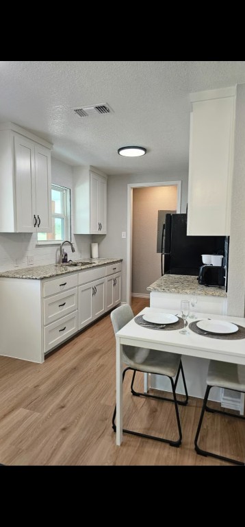 1701 Sycamore Street Temple, TX 76502 - Photo 4 of 20 a kitchen with a table and chairs