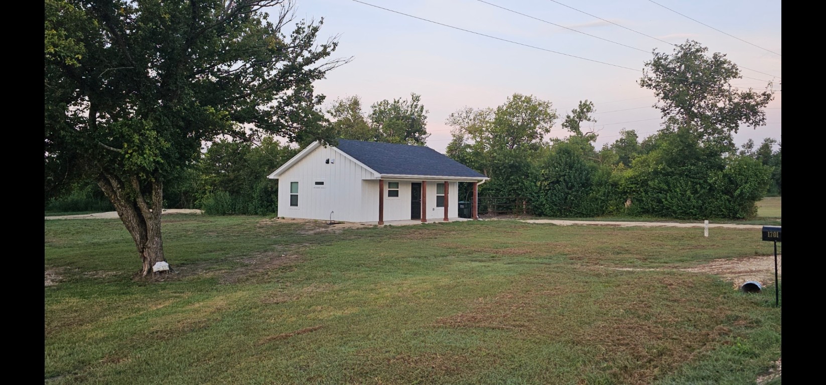 1701 Sycamore Street Temple, TX 76502 - Photo 7 of 20 a house with trees in the background