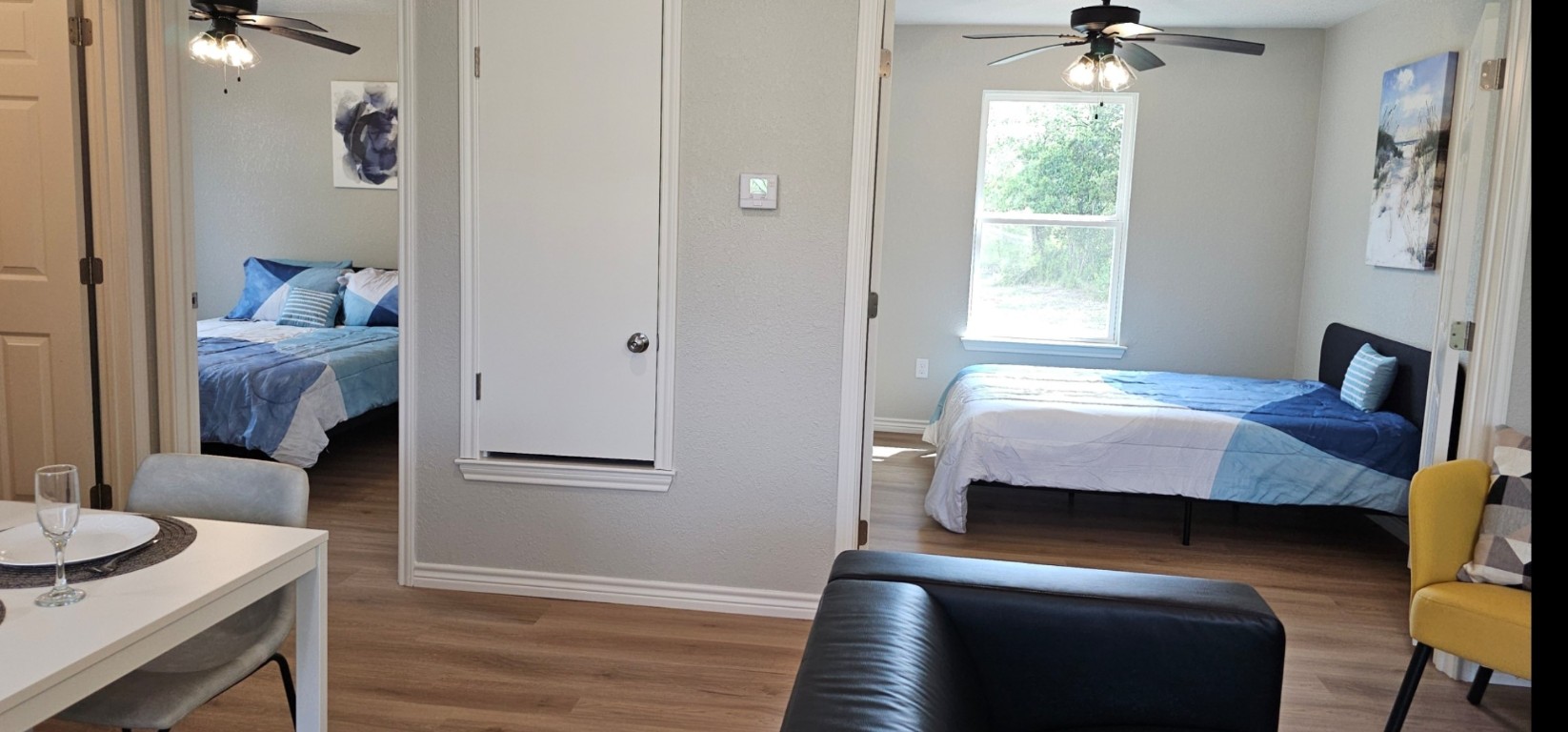 1701 Sycamore Street Temple, TX 76502 - Photo 8 of 20 a bedroom with a bed and a table in it