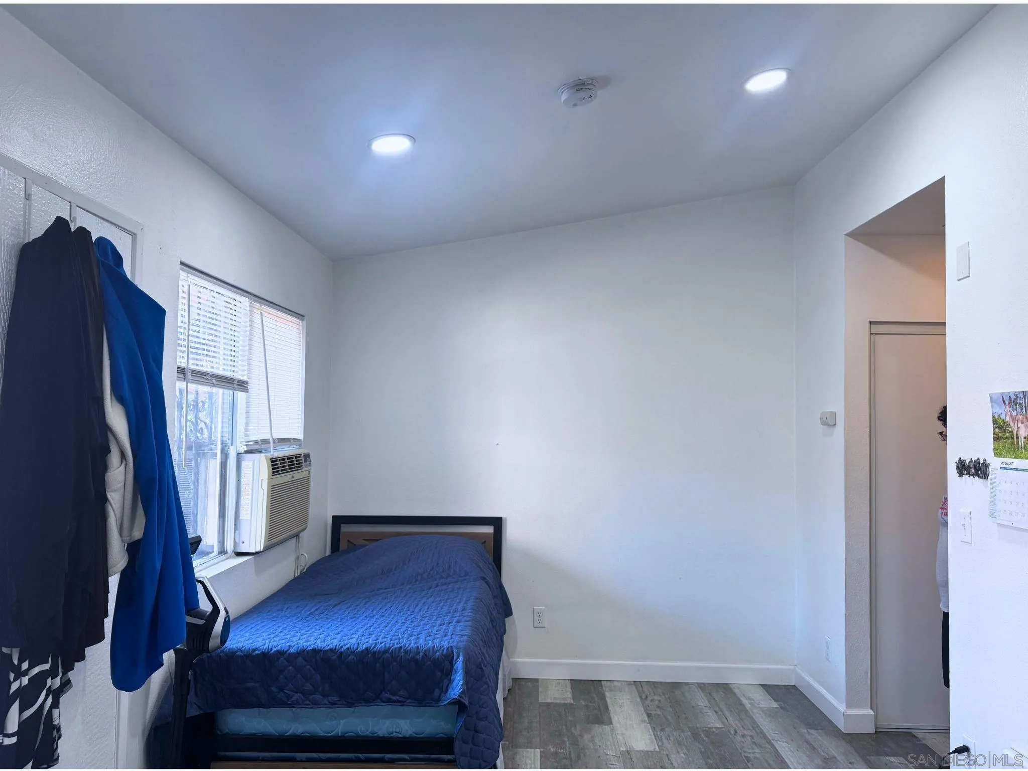 875 West San Ysidro Boulevard, Unit 14 San Ysidro, CA 92173 - Photo 19 of 21 a view of an empty room with a window