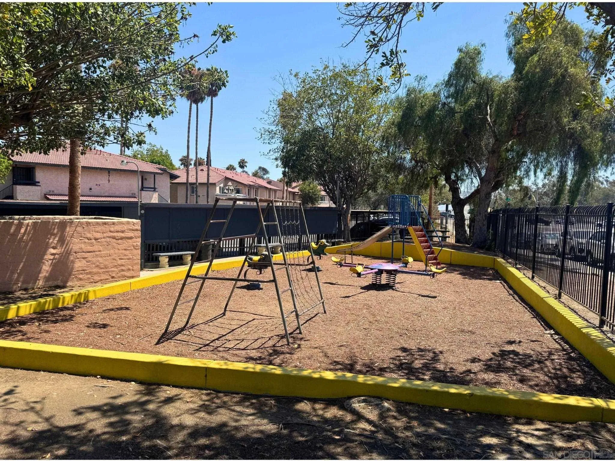 875 West San Ysidro Boulevard, Unit 14 San Ysidro, CA 92173 - Photo 3 of 21 a view of a swimming pool with a lounge chair