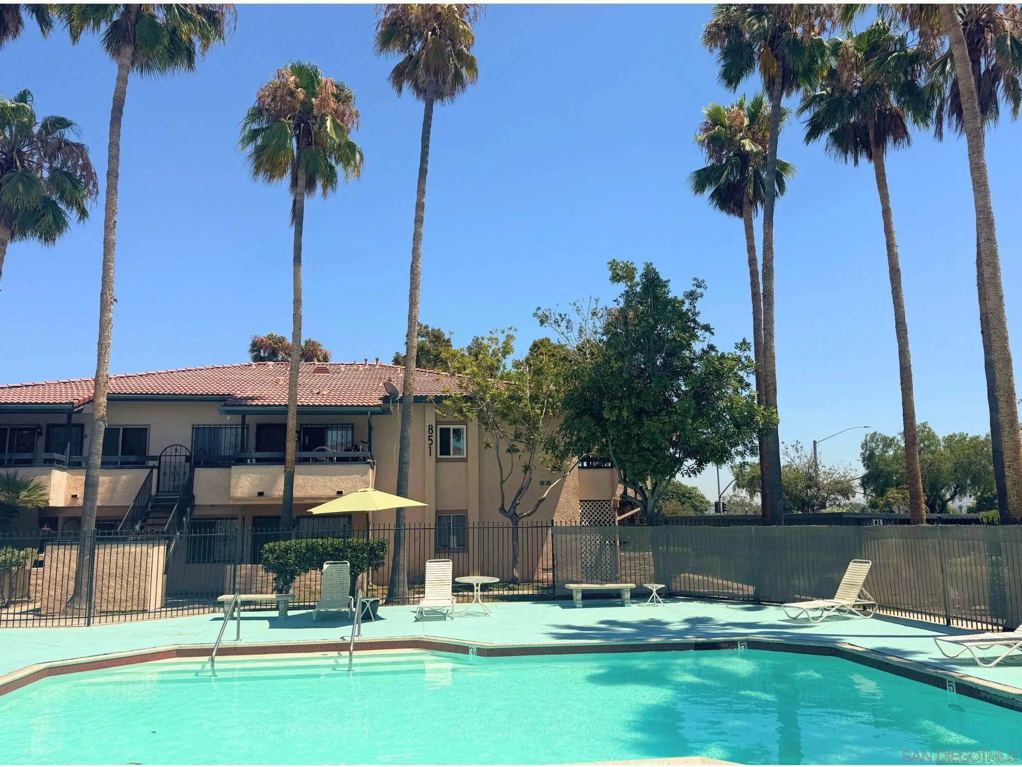 875 West San Ysidro Boulevard, Unit 14 San Ysidro, CA 92173 - Photo 7 of 21 a swimming pool with outdoor seating and yard