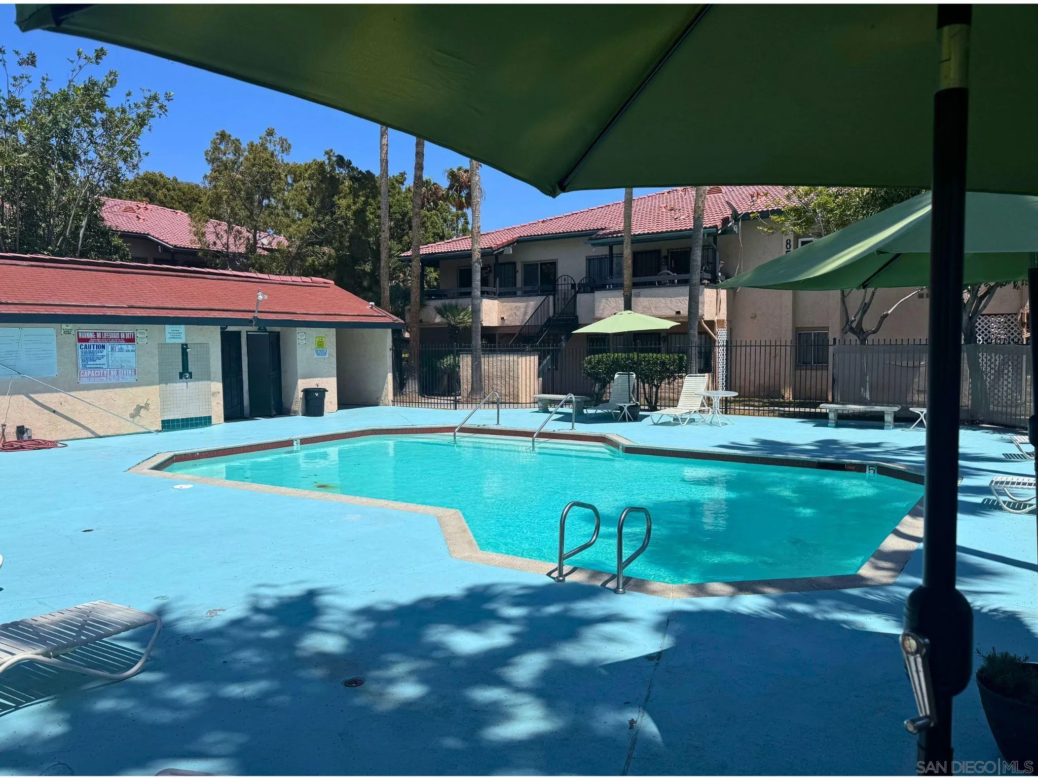 875 West San Ysidro Boulevard, Unit 14 San Ysidro, CA 92173 - Photo 8 of 21 a view of a swimming pool with a patio