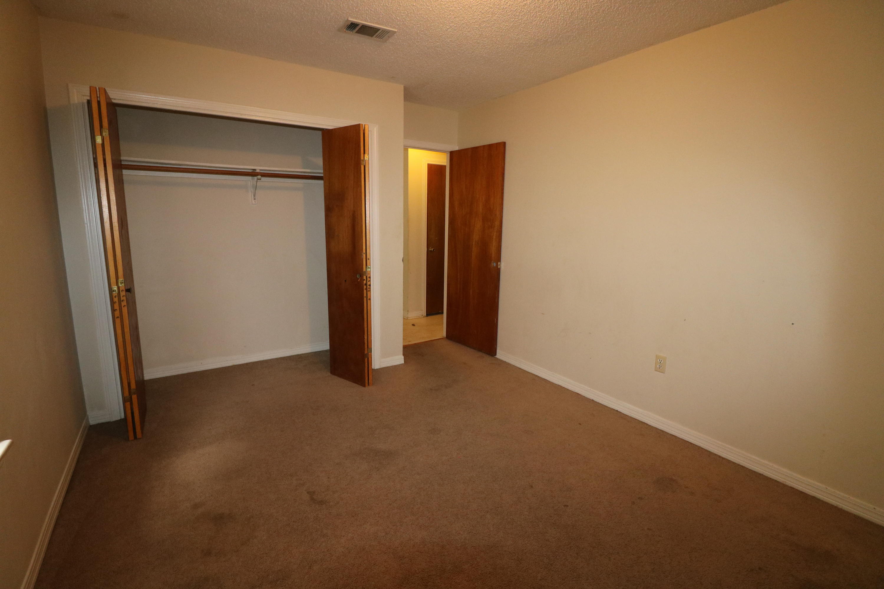 423 John King Road Crestview, FL 32539 - Photo 3 of 11 an empty room with closet area