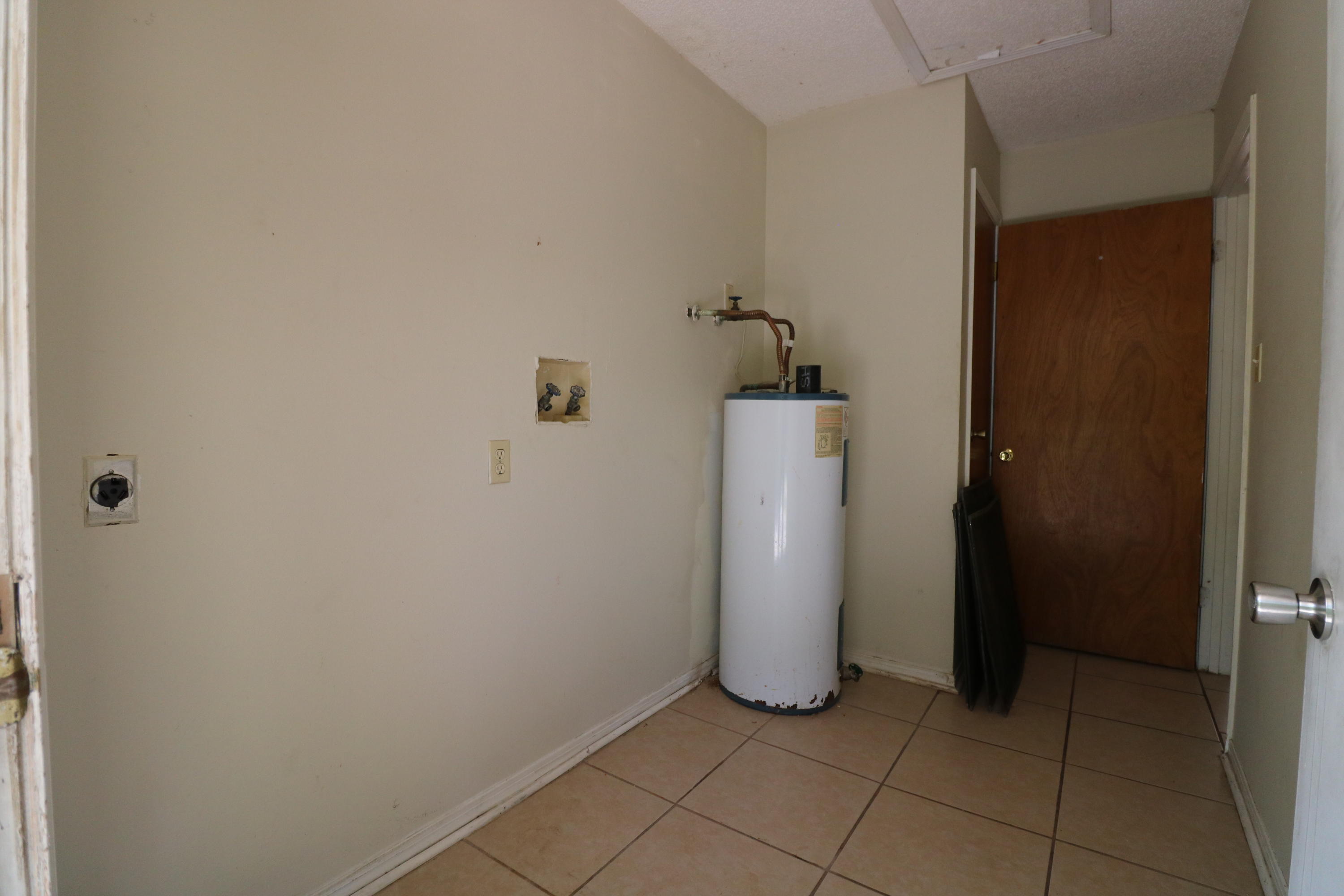 423 John King Road Crestview, FL 32539 - Photo 7 of 11 a view of a storage & utility room with washer and dryer