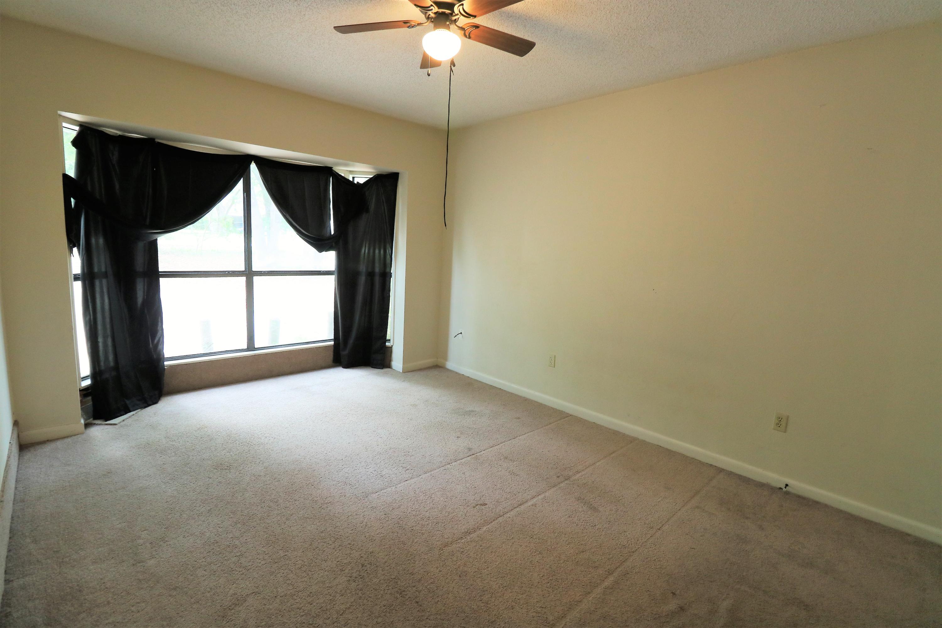 423 John King Road Crestview, FL 32539 - Photo 9 of 11 a view of empty room with a window and a ceiling fan