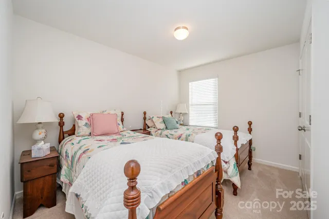 a bedroom with a bed and a table in it