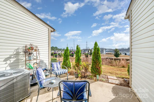 a view of balcony with furniture