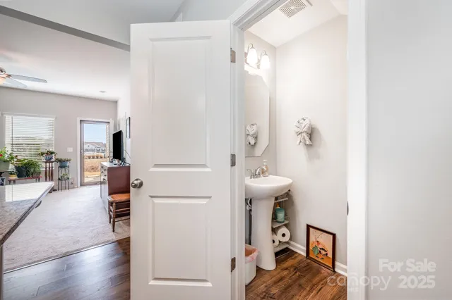 a view of a livingroom with furniture and hardwood floor