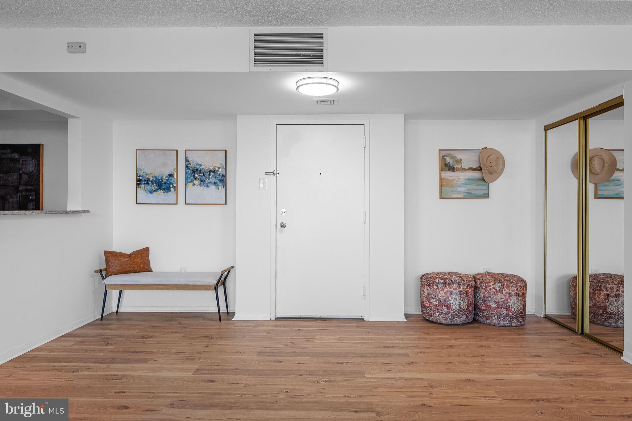 1515 South Arlington Ridge Road, Unit 703 Arlington, VA 22202 - Photo 12 of 44 a view of a livingroom with furniture and wooden floor