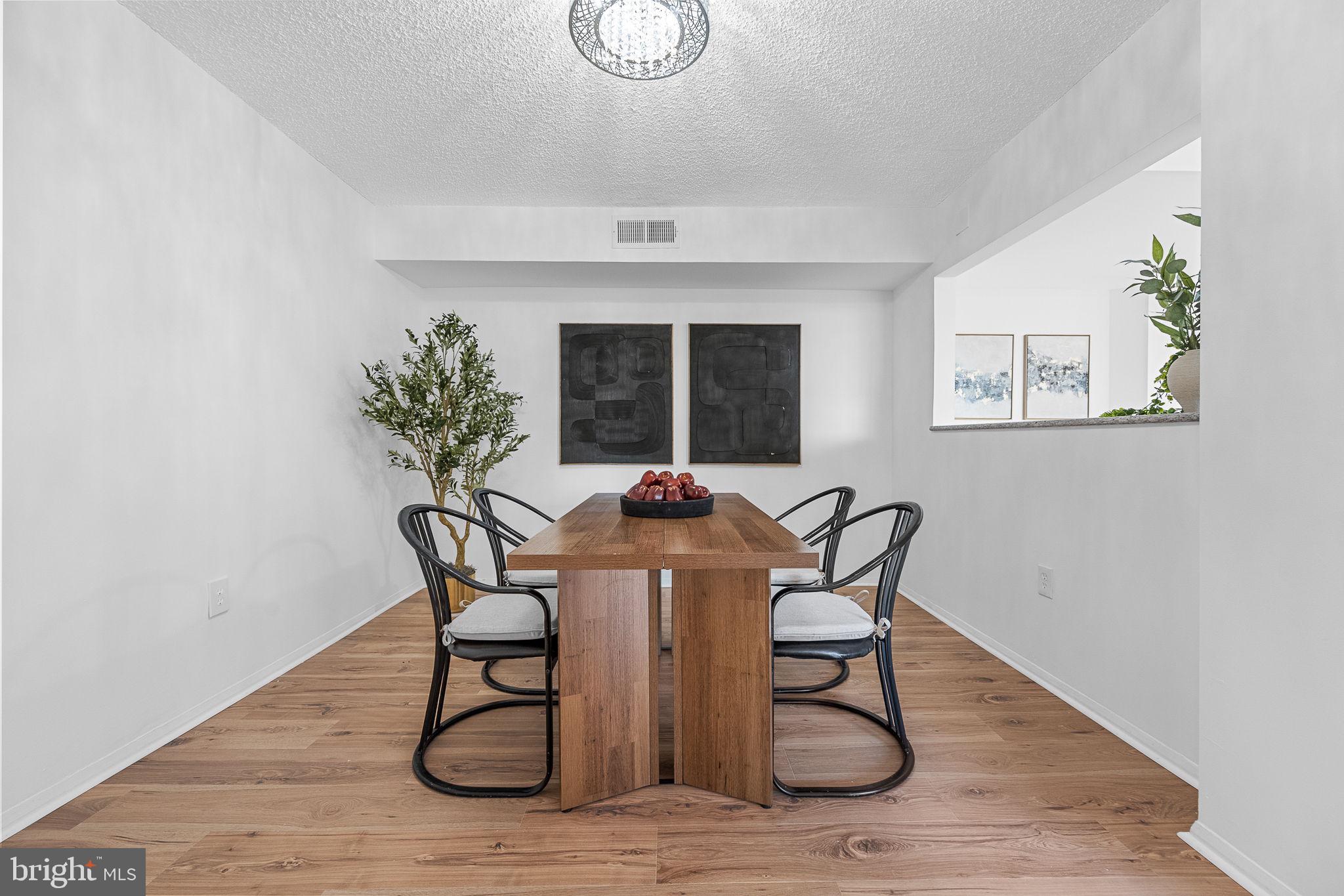1515 South Arlington Ridge Road, Unit 703 Arlington, VA 22202 - Photo 16 of 44 a dining room with furniture and window