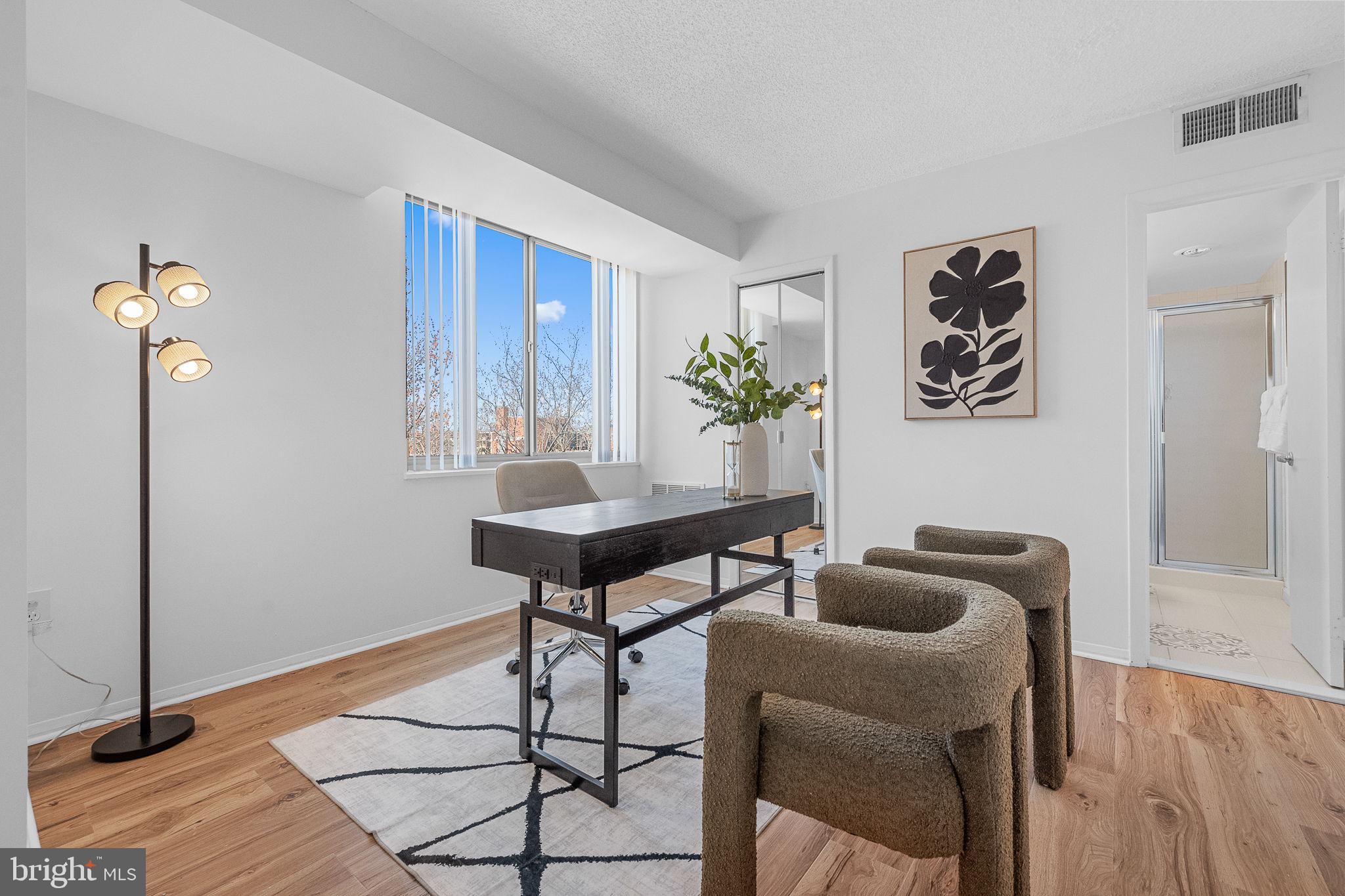 1515 South Arlington Ridge Road, Unit 703 Arlington, VA 22202 - Photo 22 of 44 a workspace room with furniture and wooden floor