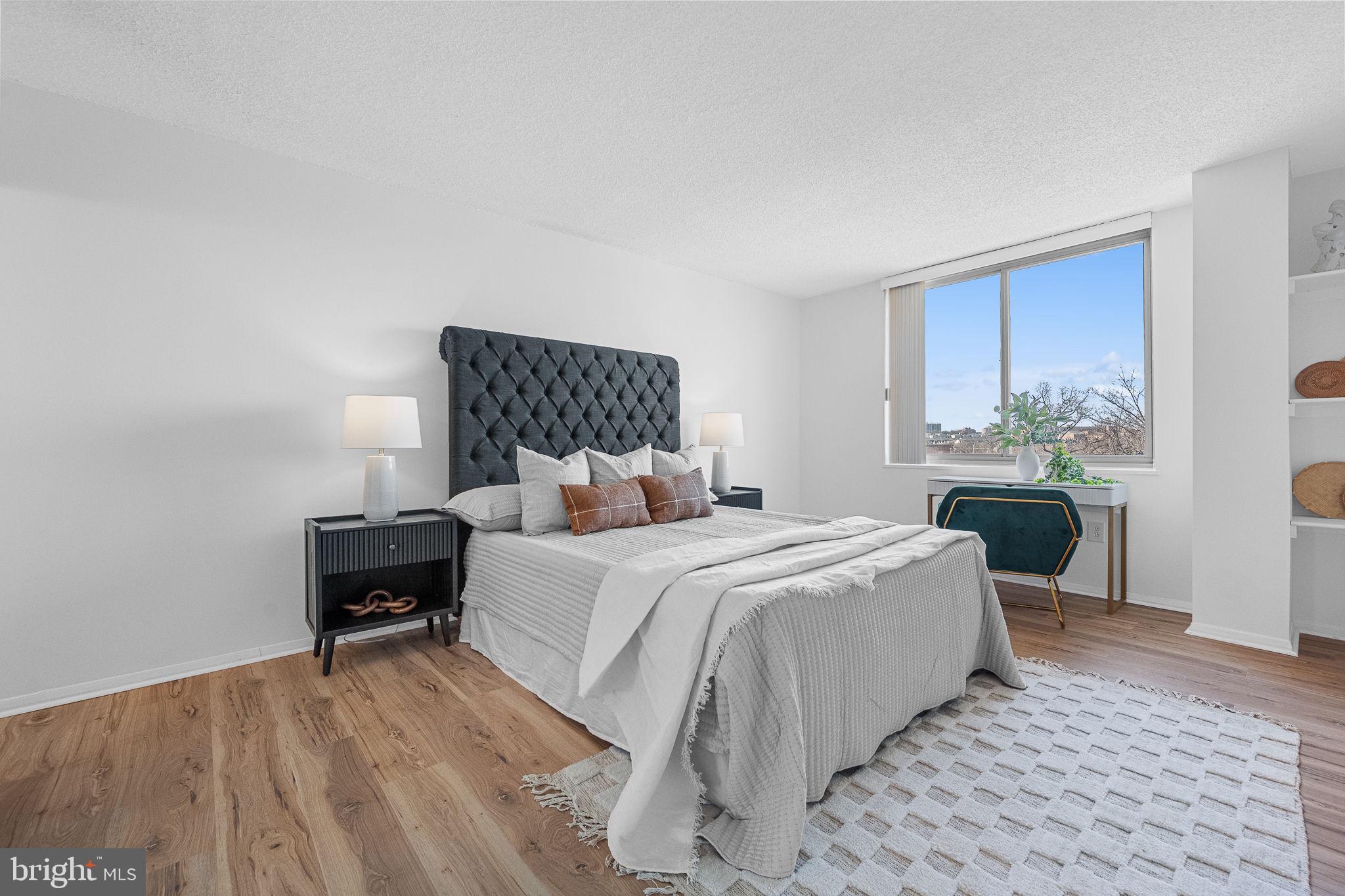 1515 South Arlington Ridge Road, Unit 703 Arlington, VA 22202 - Photo 27 of 44 a bed room with a bed and a chair