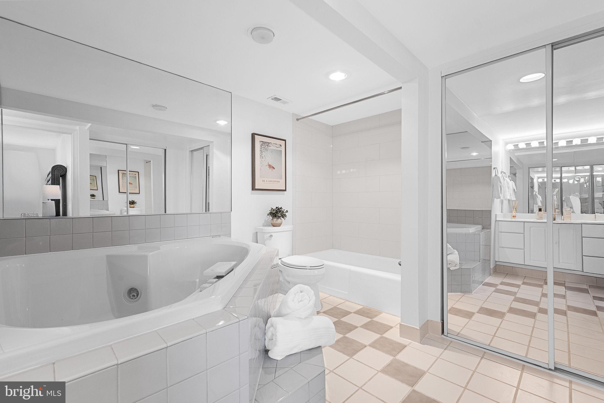 1515 South Arlington Ridge Road, Unit 703 Arlington, VA 22202 - Photo 29 of 44 a bathroom with a bathtub and a shower