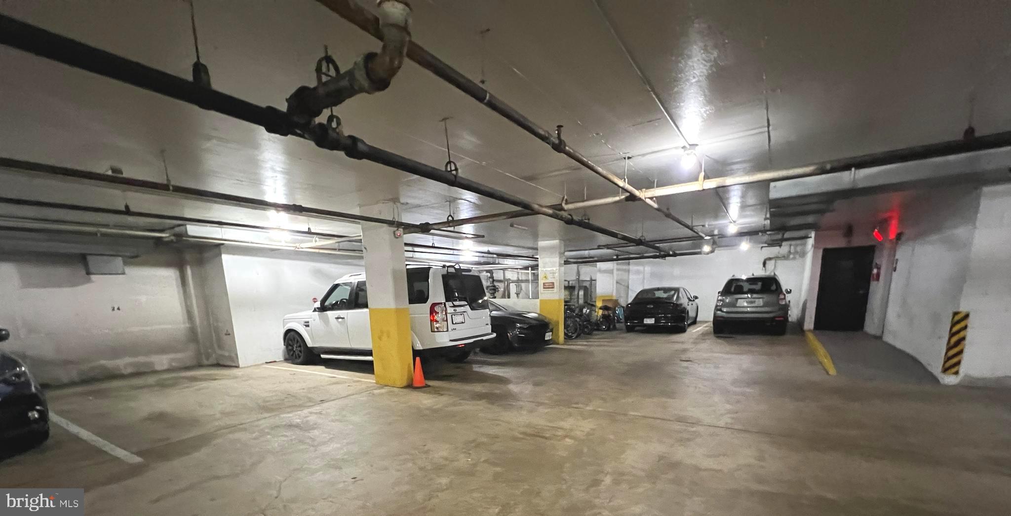 1515 South Arlington Ridge Road, Unit 703 Arlington, VA 22202 - Photo 36 of 44 a view of parking garage with cars