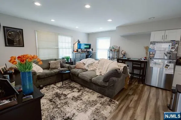 a living room with furniture fireplace and a flat screen tv