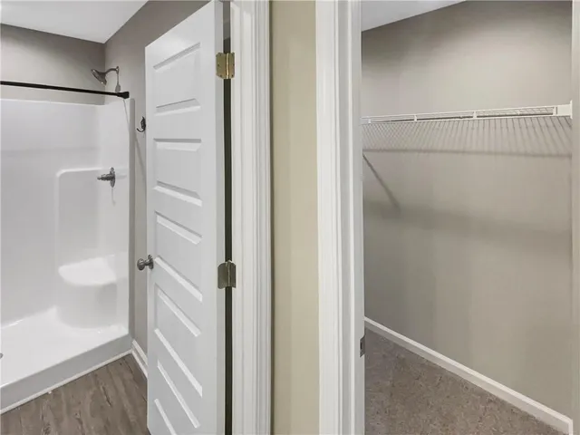 a bathroom with a glass shower door