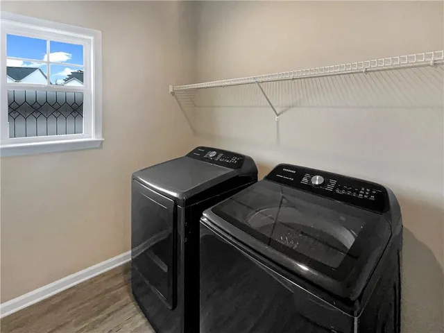 a utility room with dryer and washer