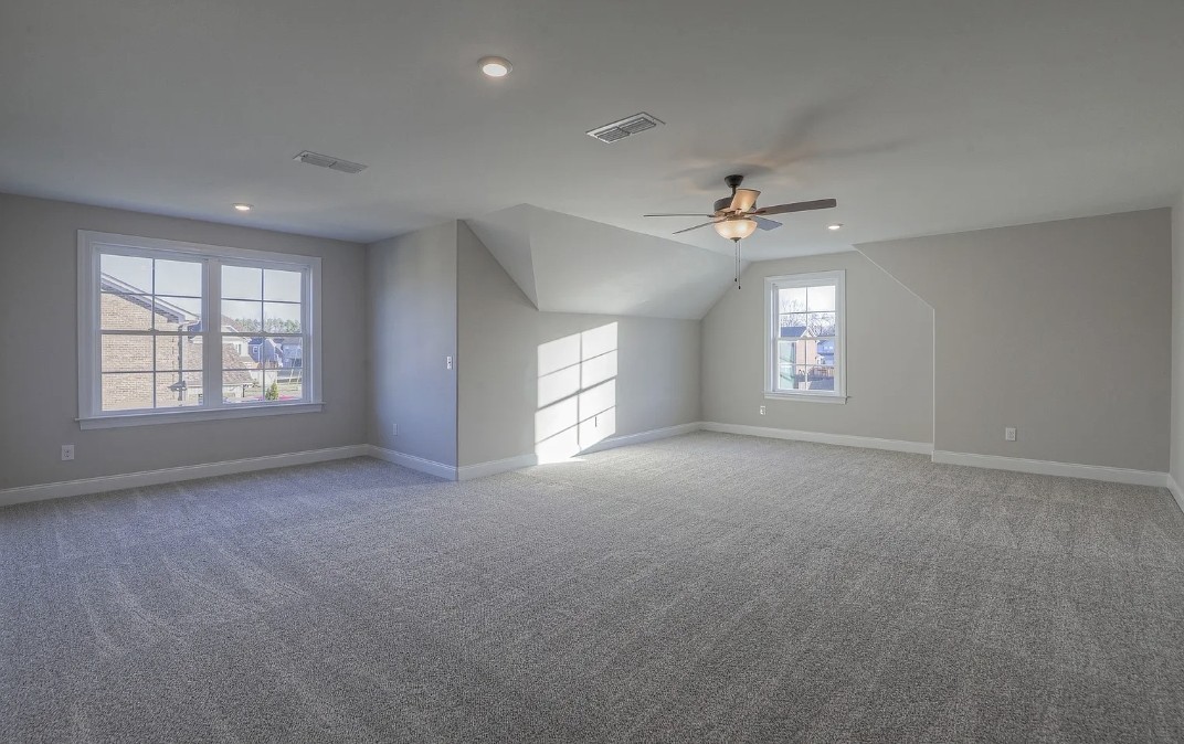 453 Ruby Oaks Lane Murfreesboro, TN 37128 - Photo 12 of 34 an empty room with a window and a ceiling fan