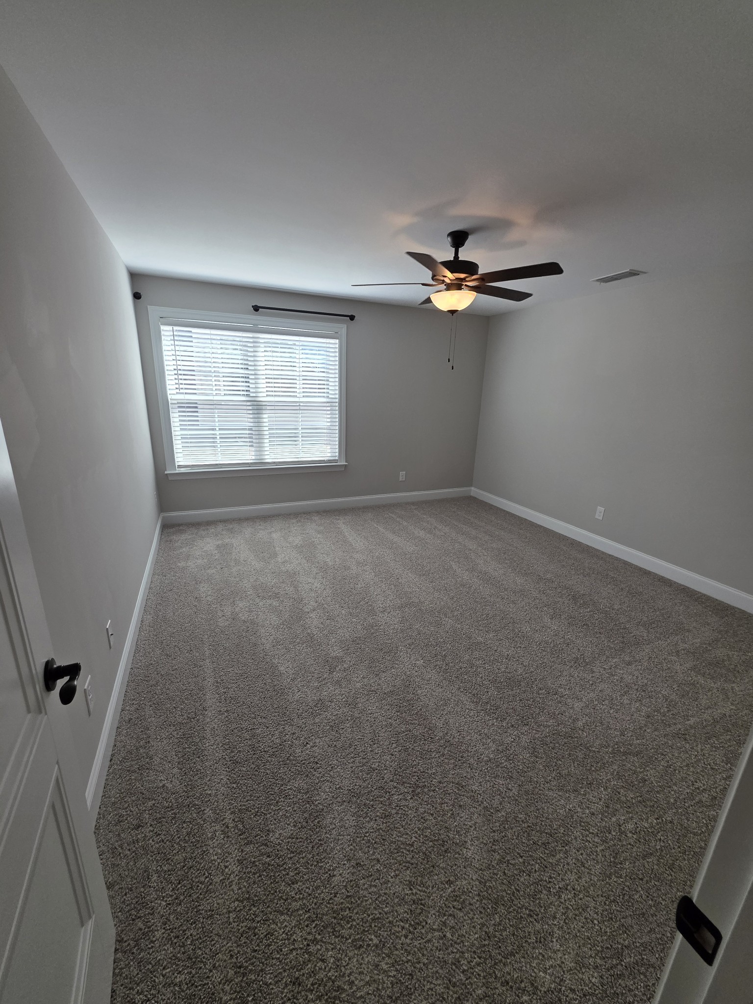 453 Ruby Oaks Lane Murfreesboro, TN 37128 - Photo 20 of 34 an empty room with windows and fan
