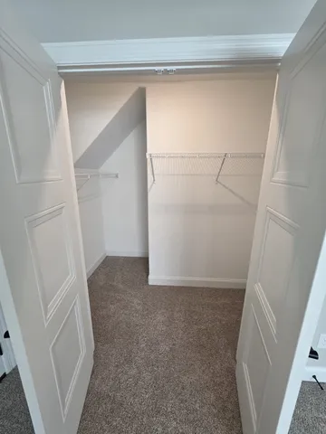 a view of a hallway with closet