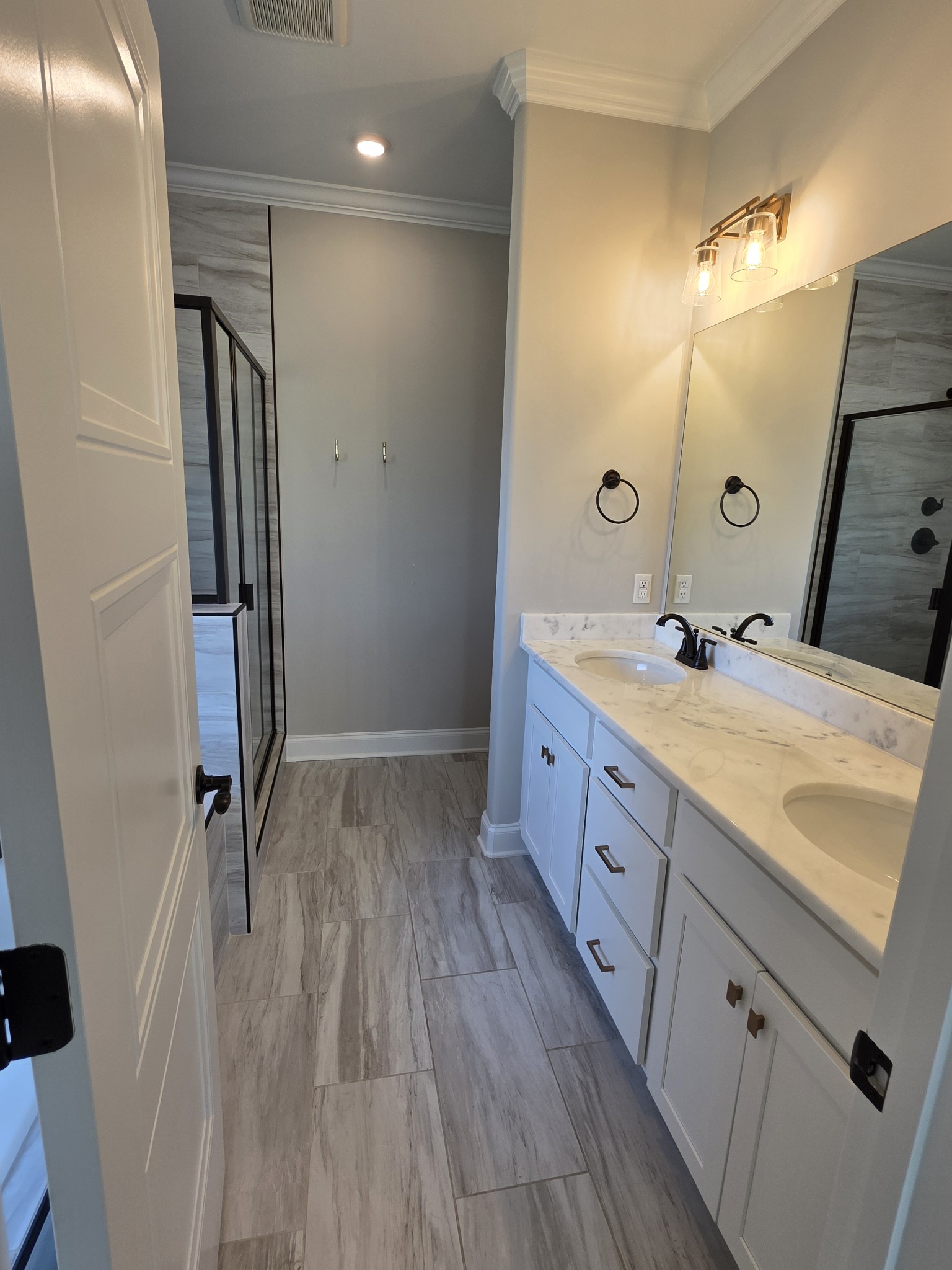 453 Ruby Oaks Lane Murfreesboro, TN 37128 - Photo 25 of 34 a spacious bathroom with a double vanity sink a mirror and shower