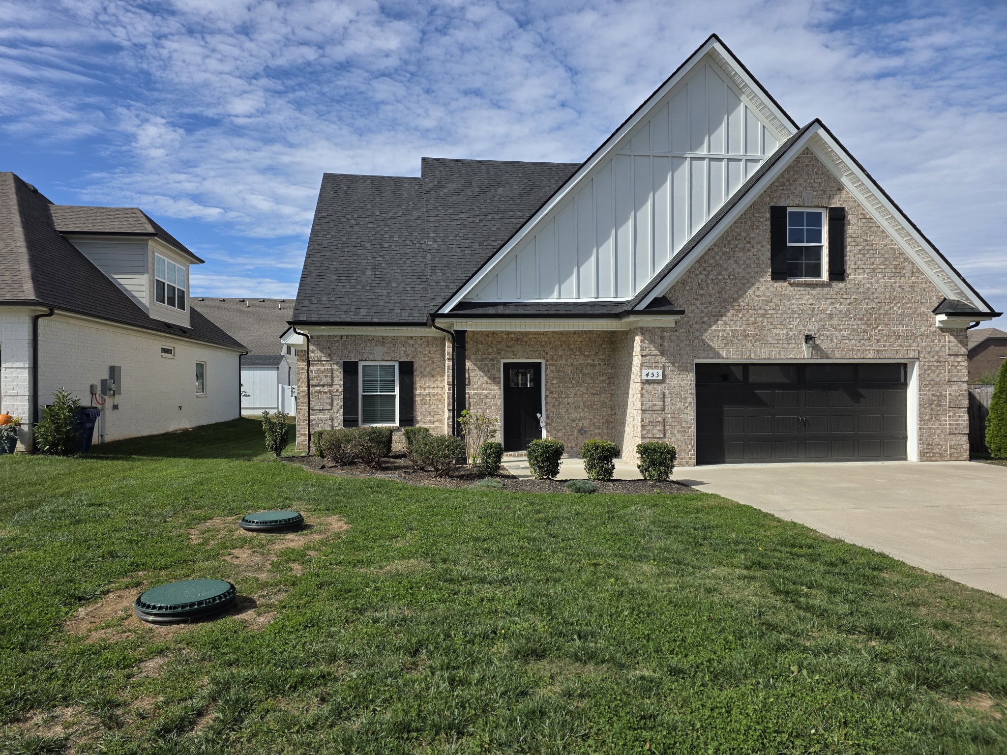 453 Ruby Oaks Lane Murfreesboro, TN 37128 - Photo 34 of 34 a front view of a house with a yard and garage