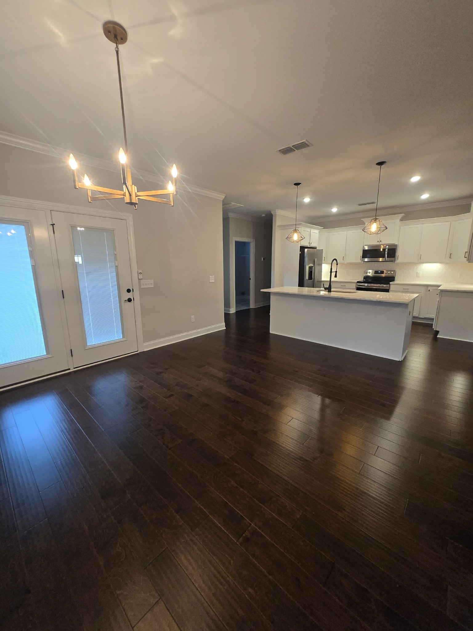 453 Ruby Oaks Lane Murfreesboro, TN 37128 - Photo 4 of 34 a view of a room with wooden floor and large windows