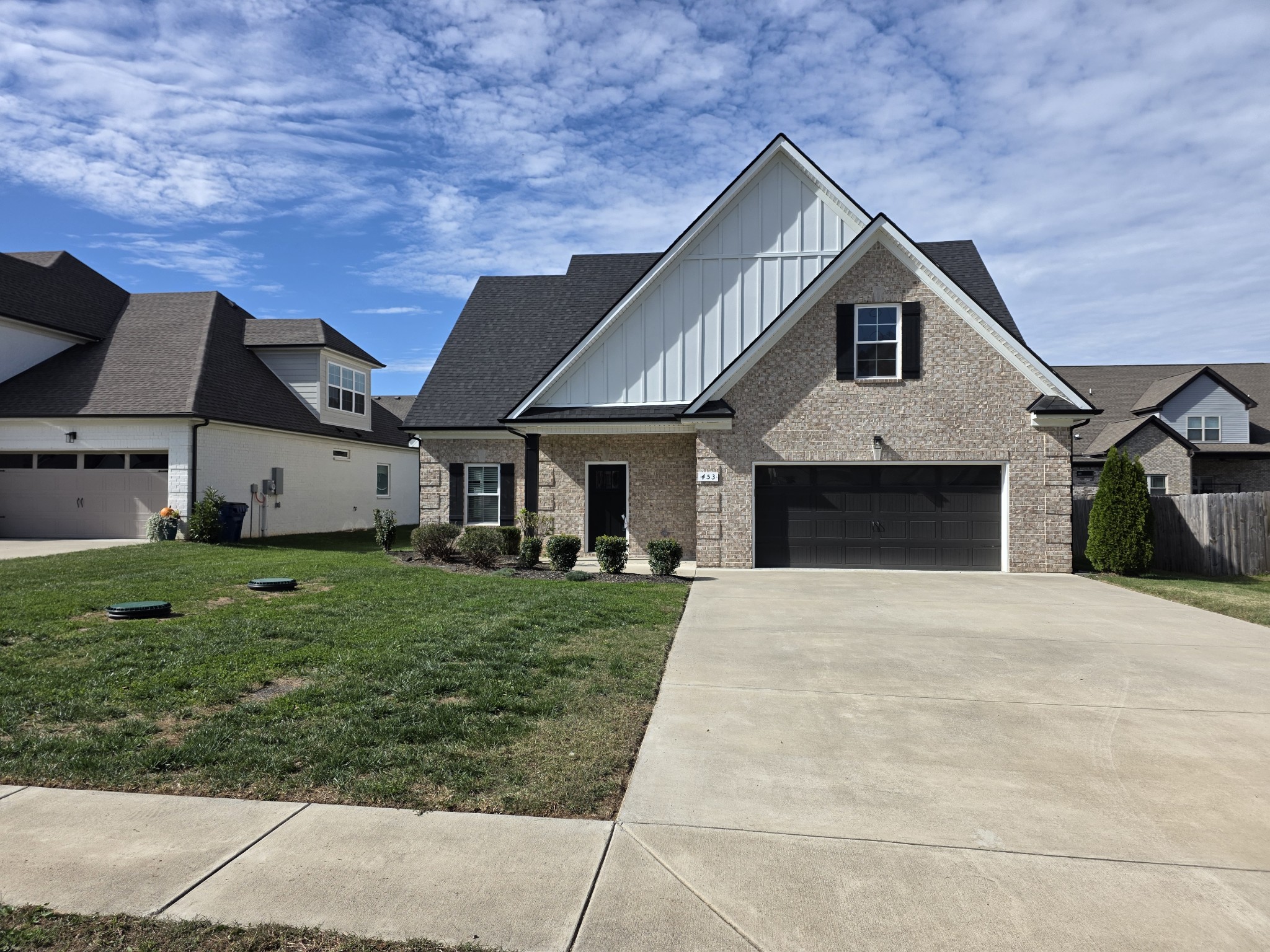 453 Ruby Oaks Lane Murfreesboro, TN 37128 - Photo 9 of 34 a front view of a house with a garden