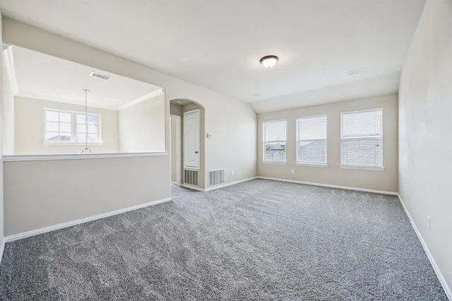 a view of an empty room with a window