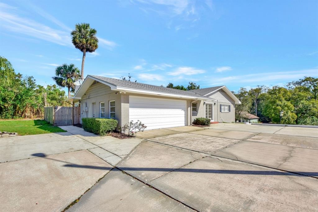 129 South Brooks Avenue DeLand, FL 32720 - Photo 1 of 1 a front view of a house with a yard and garage