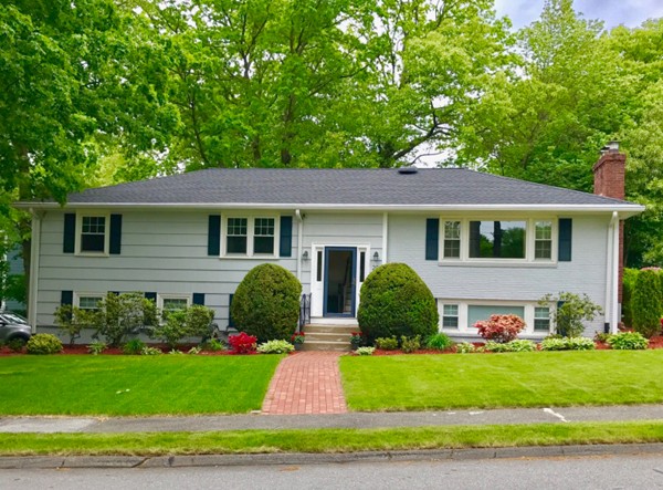 20 Poplar Road Wellesley, MA 02482 - Photo 1 of 27 a view of a house with a yard and plants