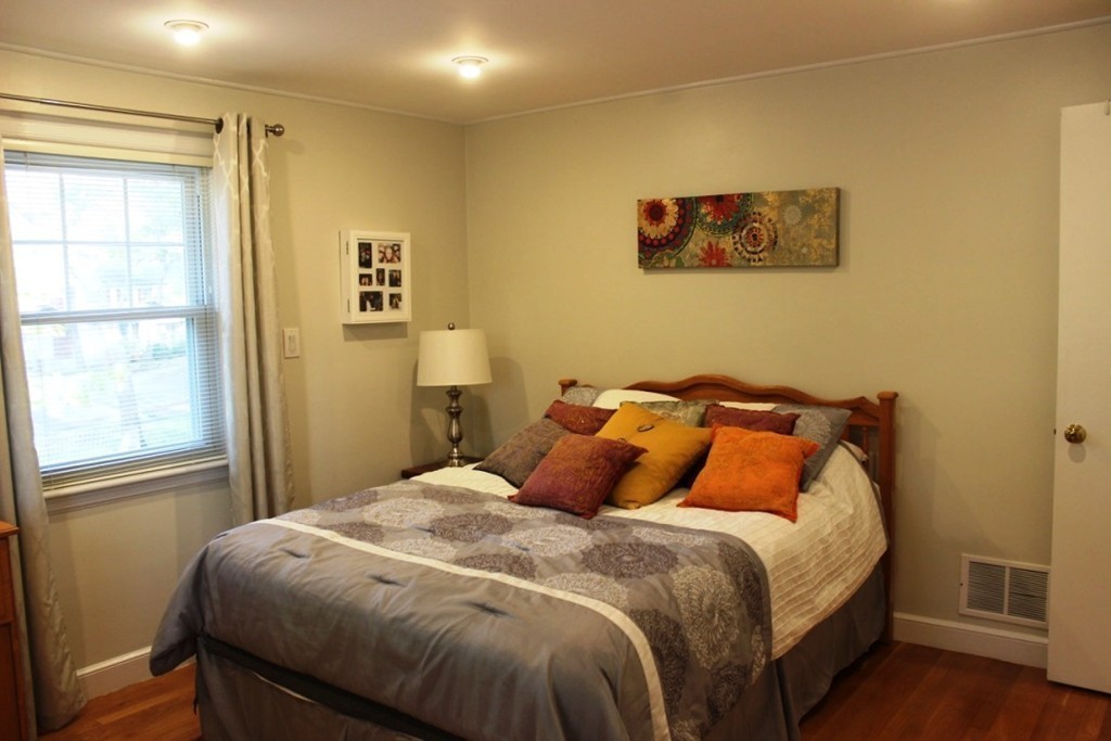 20 Poplar Road Wellesley, MA 02482 - Photo 14 of 27 a bedroom with a bed and wooden floor