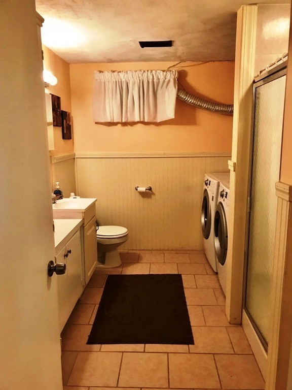 20 Poplar Road Wellesley, MA 02482 - Photo 20 of 27 a bathroom with a sink toilet and shower