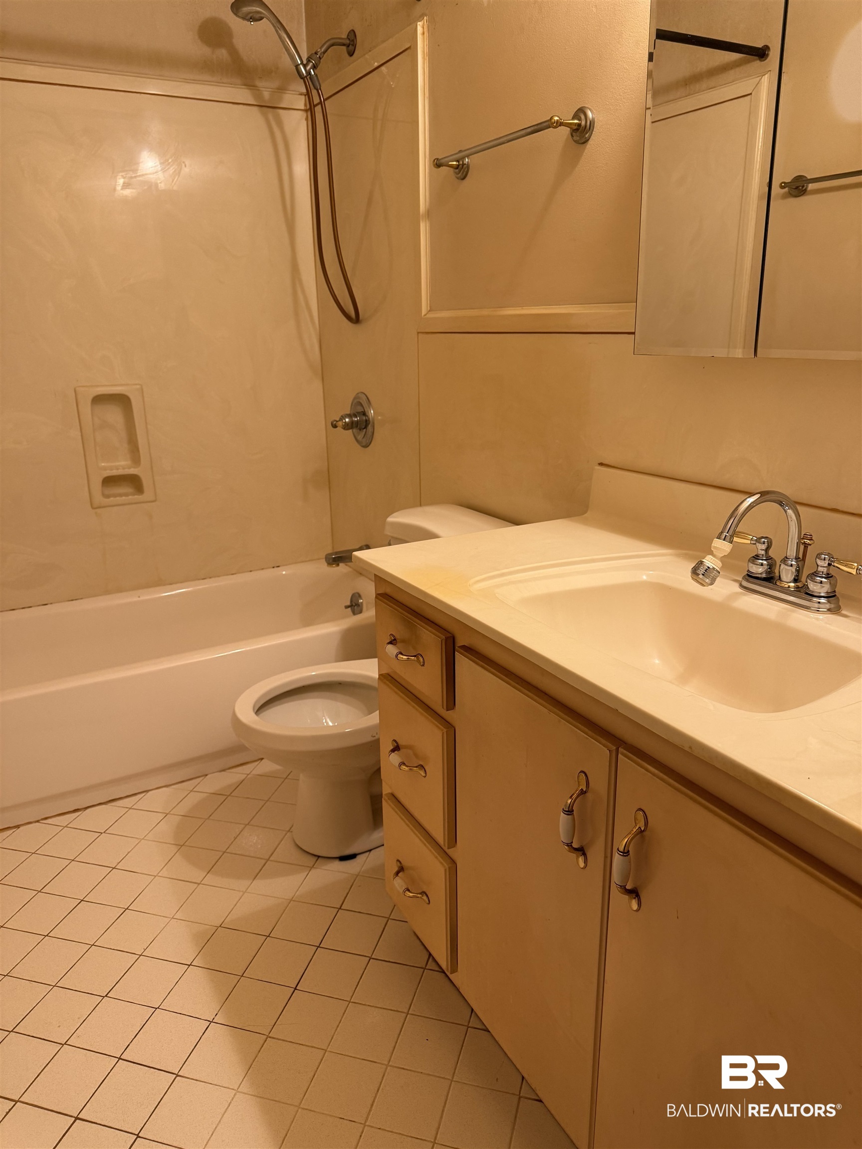 607 West Lee Street Mobile, AL 36611 - Photo 10 of 11 Full bathroom featuring vanity, shower / bathtub combination, and tile patterned flooring