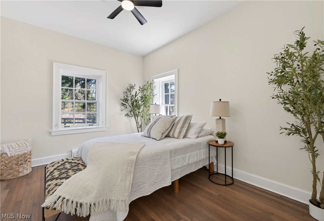 14939 Caves Road Novelty, OH 44072 - Photo 23 of 42 Bedroom featuring multiple windows, dark wood-style flooring, and a ceiling fan
