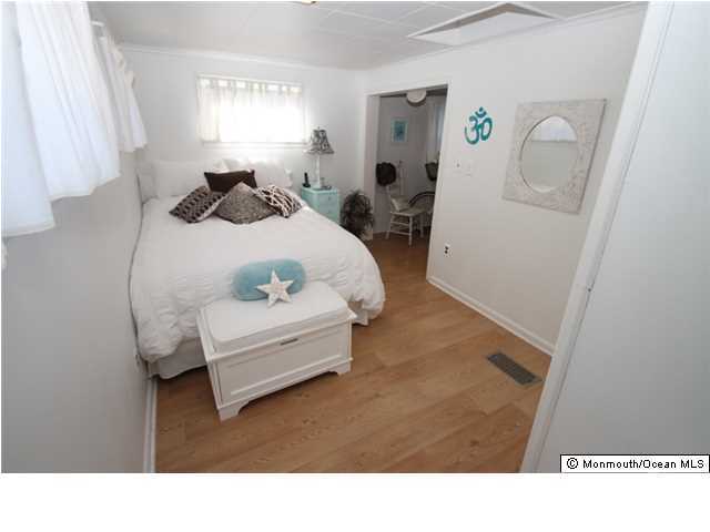 814 Sinclair Road Point Pleasant, NJ 08742 - Photo 12 of 23 a living room with furniture and a window
