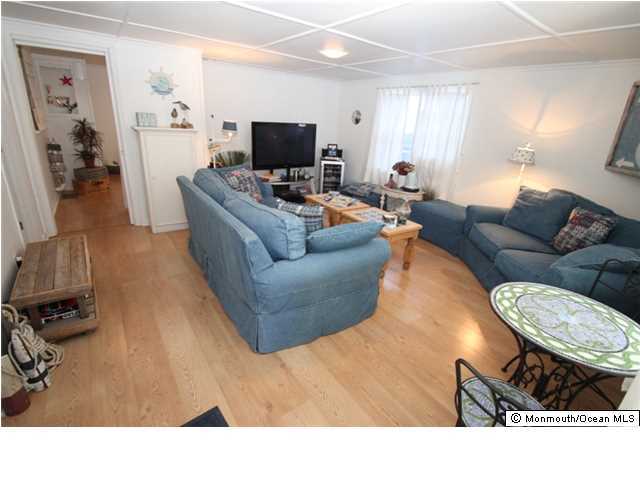 814 Sinclair Road Point Pleasant, NJ 08742 - Photo 8 of 23 a living room with furniture and a flat screen tv
