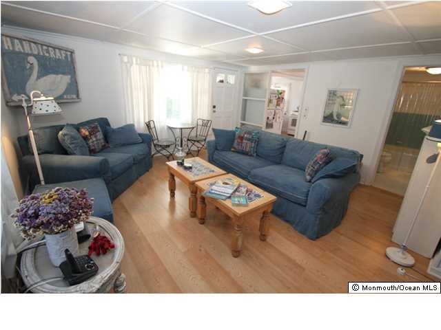 814 Sinclair Road Point Pleasant, NJ 08742 - Photo 9 of 23 a living room with furniture and a rug