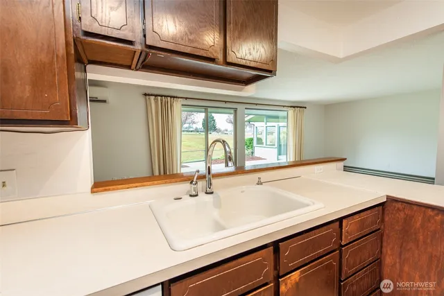a bathroom with a sink and a large mirror