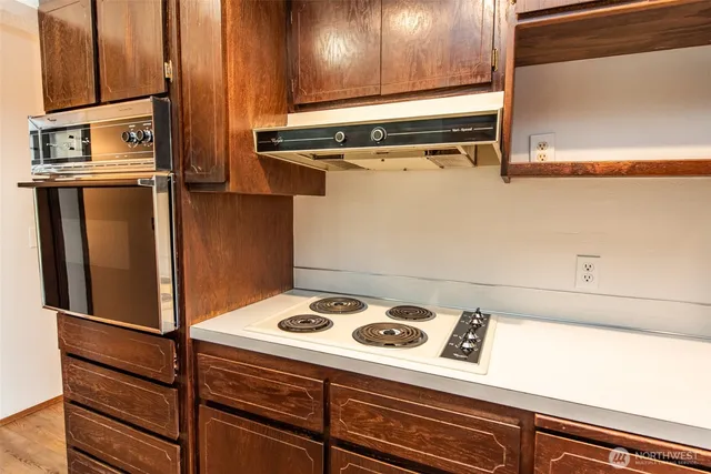 a view of a kitchen with appliances