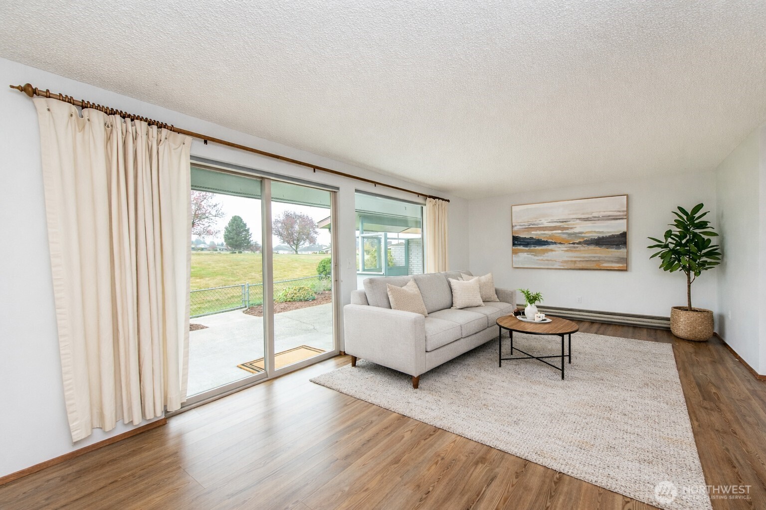 1301 South 3rd Avenue, Unit 19D Sequim, WA 98382 - Photo 18 of 35 a living room with furniture and a large window
